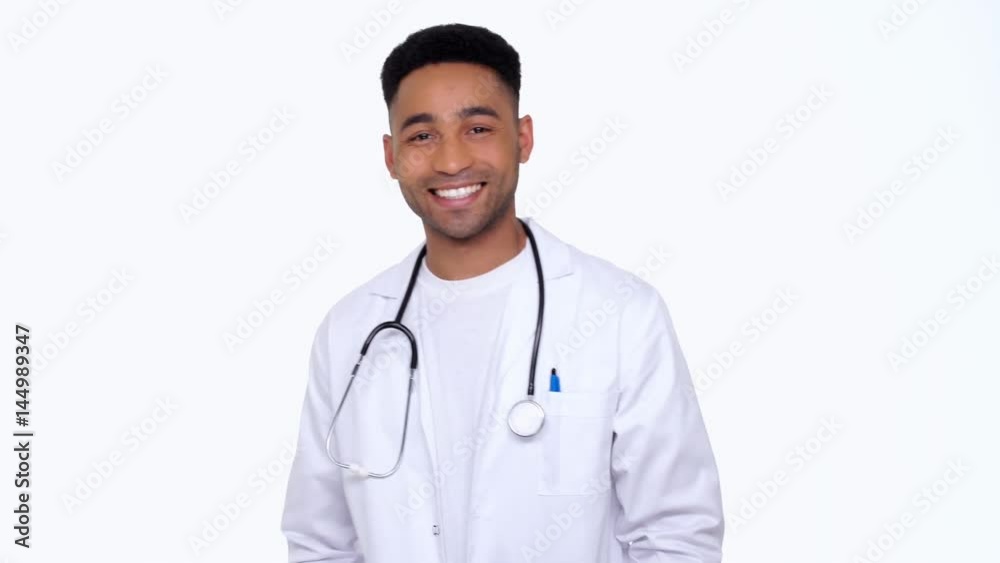 Young man using smartwatches and smiling isolated Young man using smartwatches and smiling isolated