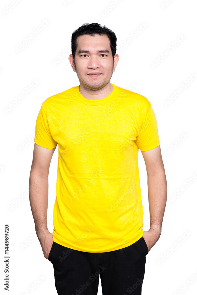 Handsome man in a blank front yellow t-shirt isolated on white background. Handsome man in a blank front yellow t-shirt isolated on white background.