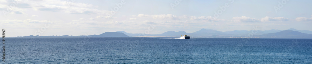   Ocean Panorama Ferry  with the Northern Coast of Fuerteventura and the Island of Lobos in the Background.