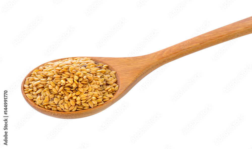 Flax seeds heap in wood spoon isolated on white background Flax seeds heap in wood spoon isolated on white background