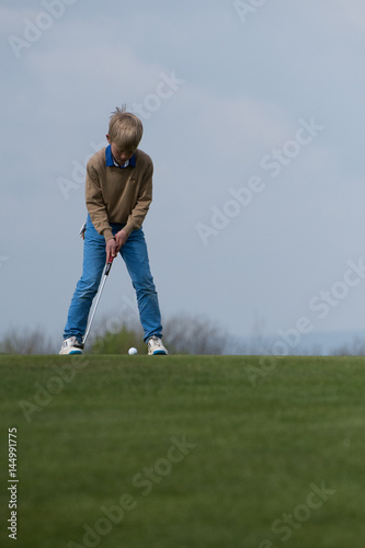 Junger Golfer - Ehrgeiz ist alles! photo