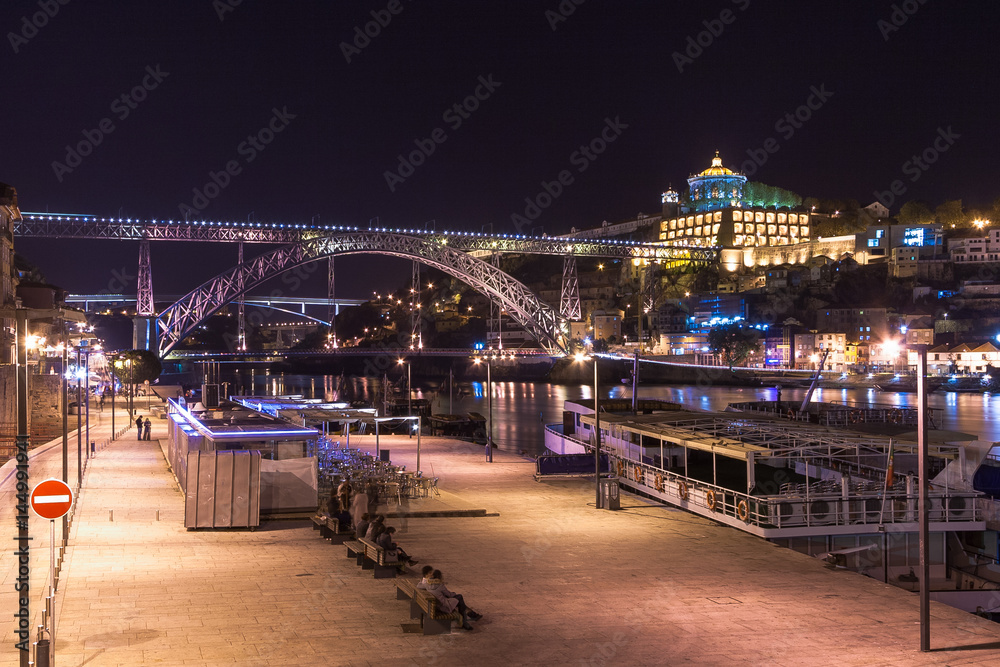 Porto by night. View of the waterfront Douro River and Luis I Bridge. Portugal