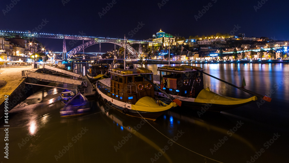 Porto by night. View of the waterfront Douro River and Luis I Bridge. Portugal