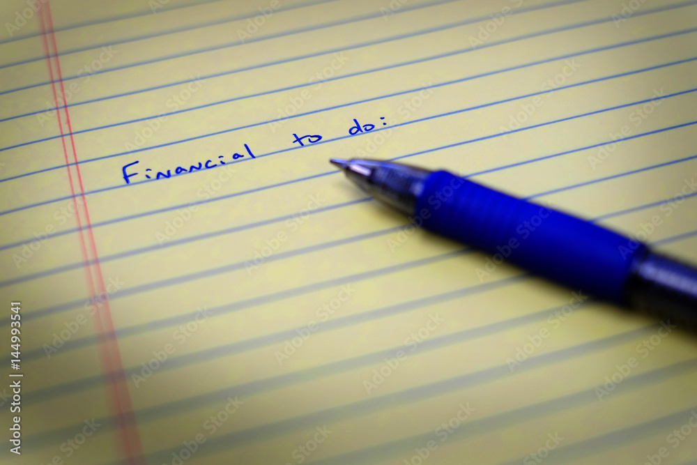 To Do List on Notebook Paper and Pen Financial To Do List on Notebook Paper and Pen Financial