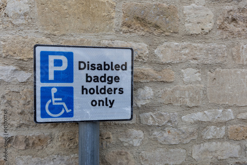 disabled or handicapped badge holder parking sign
