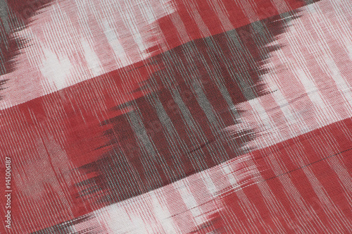 background of silk fabric with oriental ornaments. uzbek silk with ornament