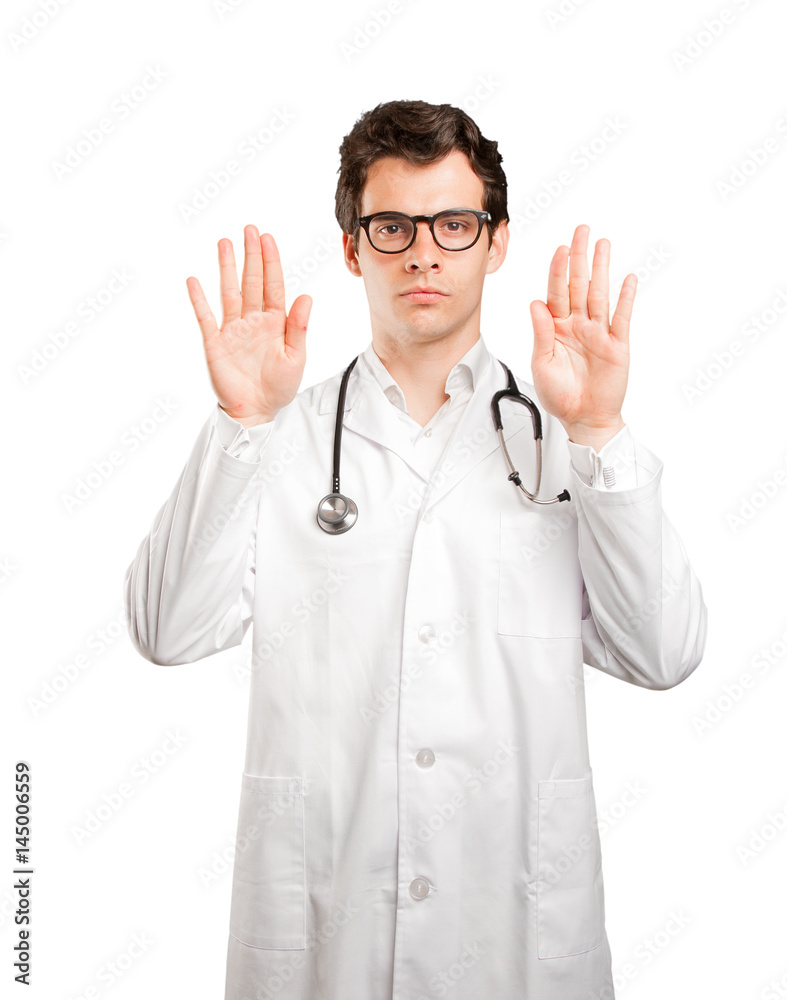 Serious doctor with a gesture of prohibition against white background Serious doctor with a gesture of prohibition against white background
