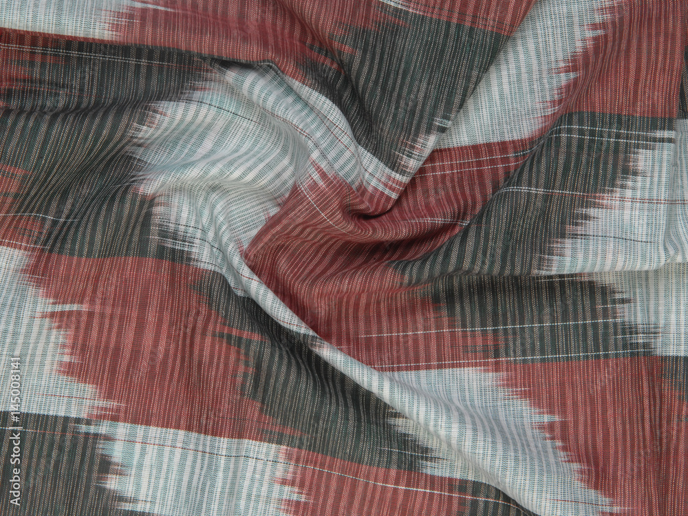 background of silk fabric with oriental ornaments. uzbek silk with ornament background of silk fabric with oriental ornaments. uzbek silk with ornament