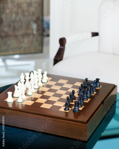 Obraz na płótnie Chess game on table in living area, selective focus w salonie