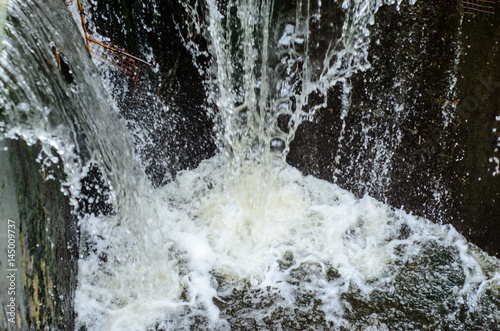Water flowing from a dam © ihorbondarenko
