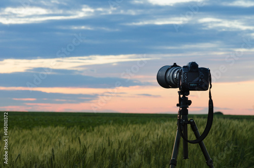 Proffessional camera on Tripod is taking photos