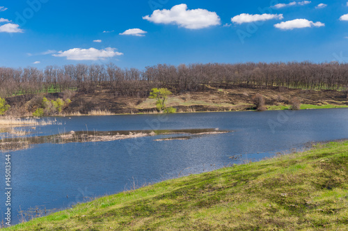 Spring landscape with Suha Sura river in Vasylivka village near Dnepr city, in central Ukraine photo