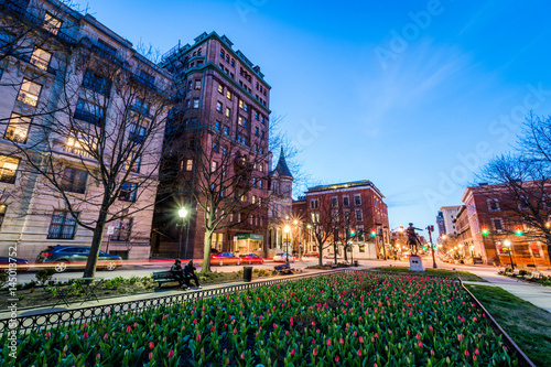 downtown mount vernon at night shot from the red tulip garden in baltimore, maryland photo