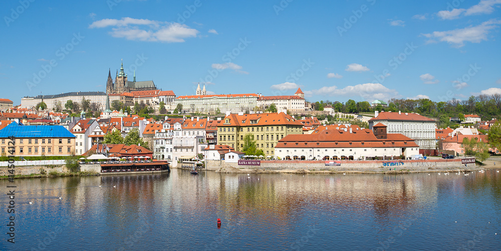PRAGUE, CZECH REPUBLIC - APRIL 17, 2014: View site the Vltava River to see Prague Castle PRAGUE, CZECH REPUBLIC - APRIL 17, 2014: View site the Vltava River to see Prague Castle