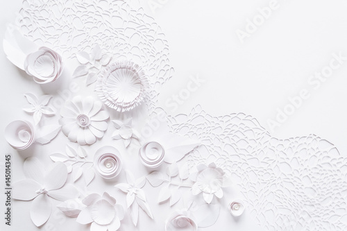 laser cutting, floral composition with white paper flower on white background photo