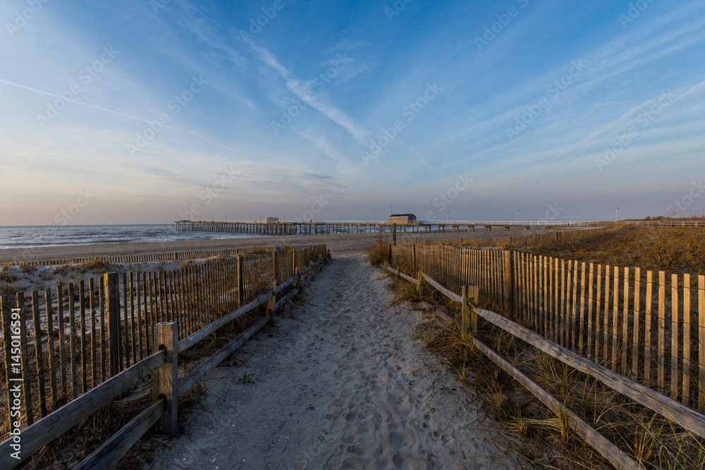 Path leading to ventnor city beach in atlantic city, new jersey at sunrise