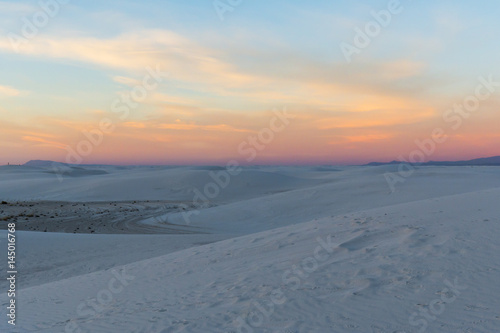 colorful sunset over the white sand dunes