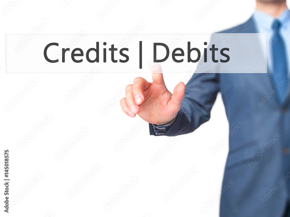 Credits Debits - Businessman hand pressing button on touch screen interface. Credits Debits - Businessman hand pressing button on touch screen interface.