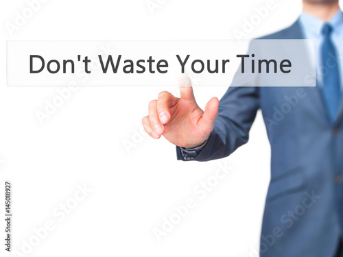 Don't Waste Your Time - Businessman hand pressing button on touch screen interface.