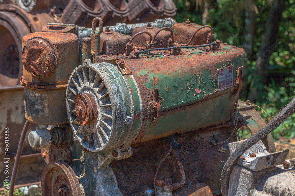 Old machinery rusted up.after the mine.After the mining industry was completed, the mining equipment was left rusty.