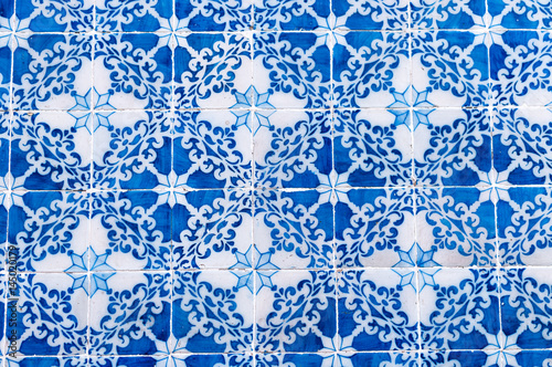 Traditional antique azulejo on the walls of old houses in Lisbon. Background. Portugal
