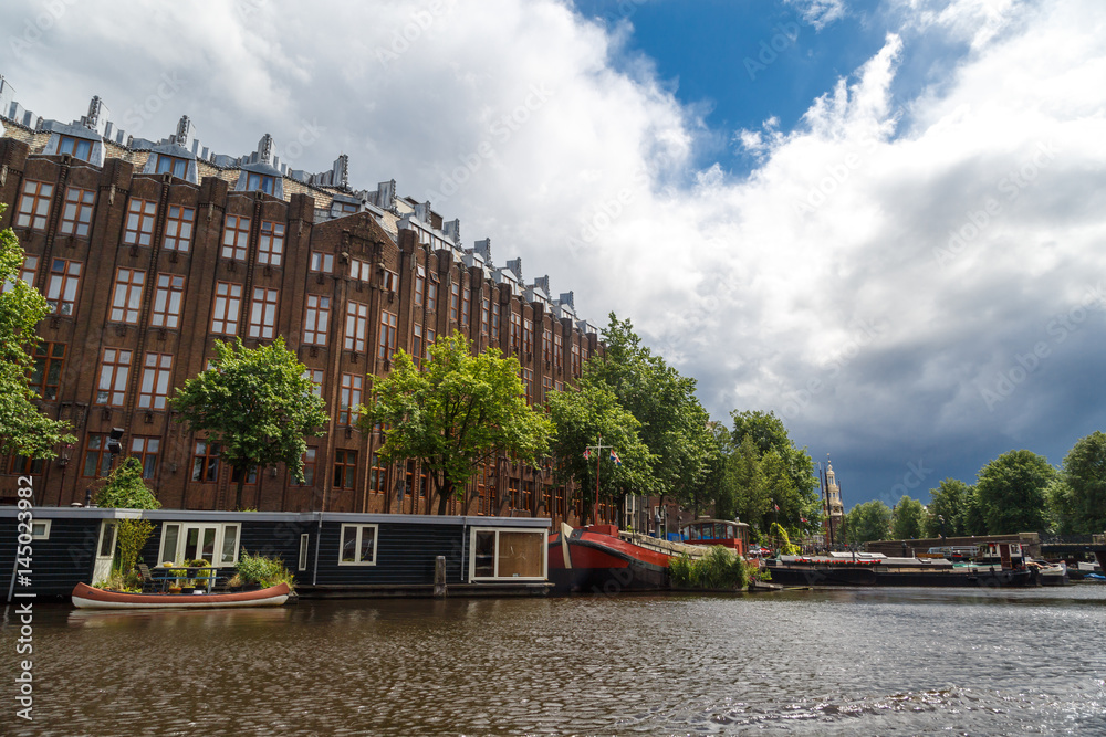 Naklejka premium Houses Along Canal