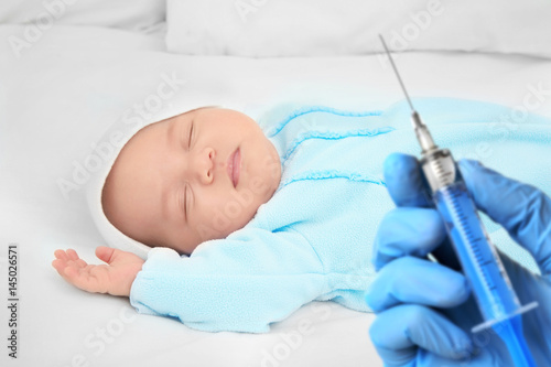 Cute baby sleeping on bed