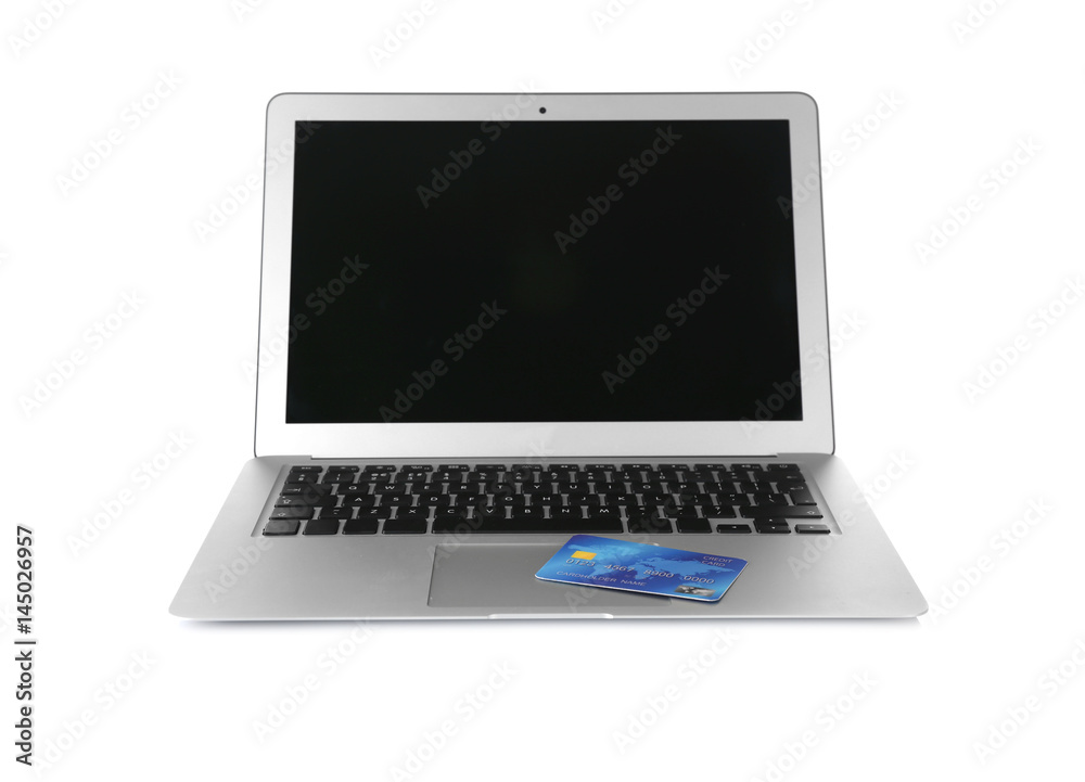Online shopping concept. Laptop with credit card on white background Online shopping concept. Laptop with credit card on white background