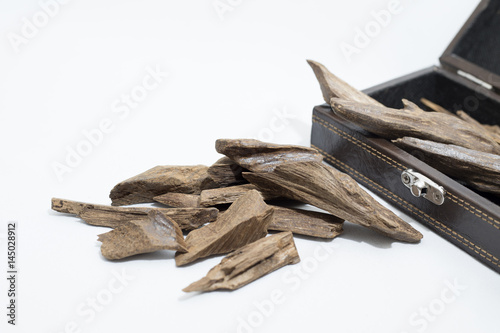 Agarwood, incense Chips around a leather box, it's name in Arabic Oud Wood used to incense Cloths, furniture and places for occasions