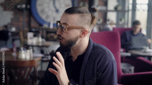 The first date in the cafe. The guy tries to impress the girl, he tells you something emotionally. A couple in a beautiful restaurant,