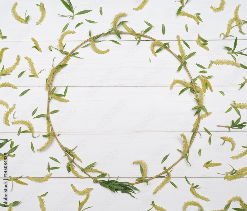 Decorative frame from a tree branch on a white background