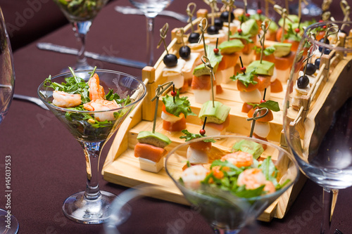 there are points and salad, a canape, panna cotta on a table at restaurant