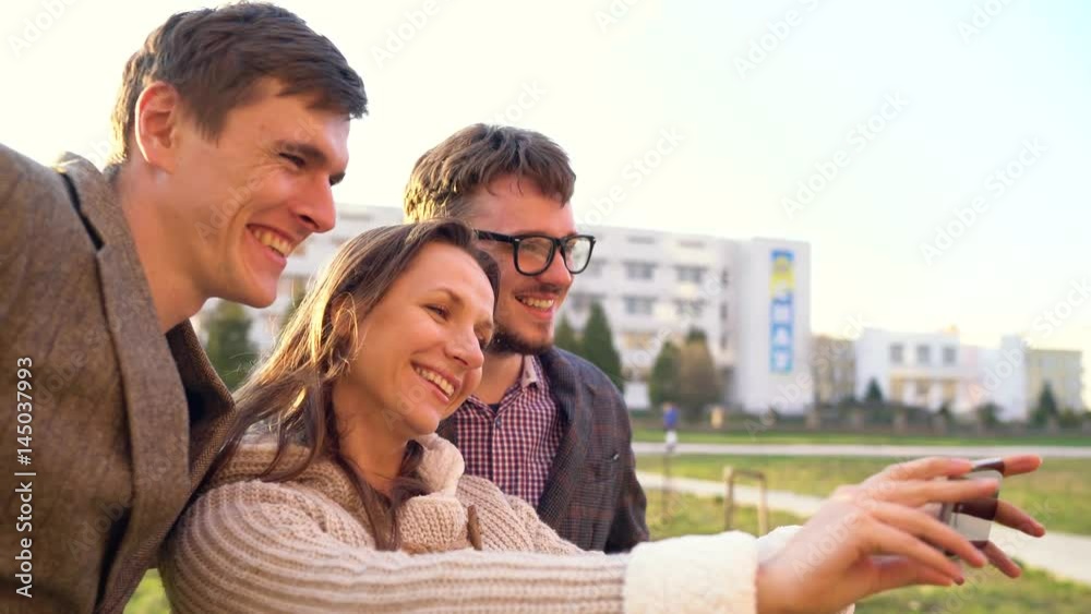 Smiling friends making selfie outdoors Smiling friends making selfie outdoors