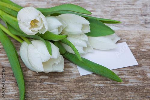 Fototapeta Naklejka Na Ścianę i Meble -  white tulips bouquet and blank greeting card