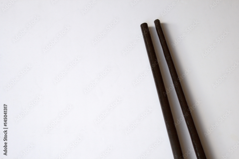 Chinese asian chop-sticks, black lacquer, isolated on white background Chinese asian chop-sticks, black lacquer, isolated on white background