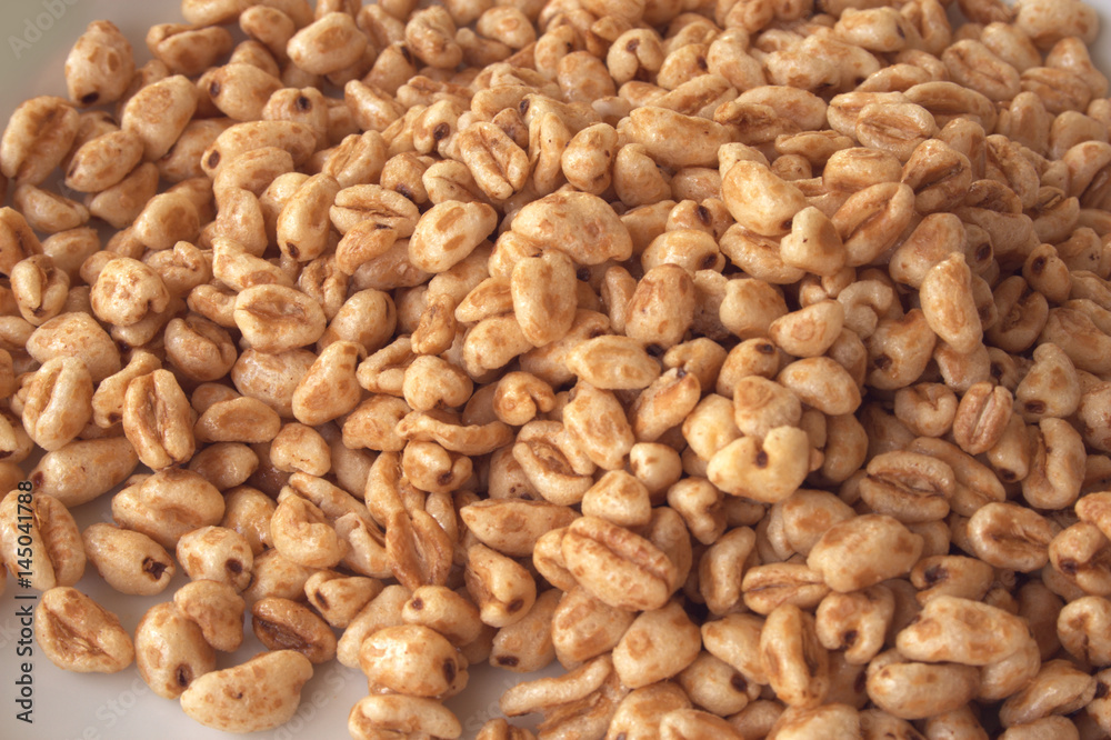 Pile of puffed wheat breakfast cereal isolated on white background Pile of puffed wheat breakfast cereal isolated on white background