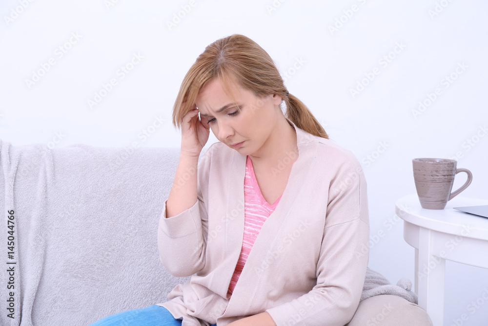 Senior woman suffering from headache at home Senior woman suffering from headache at home
