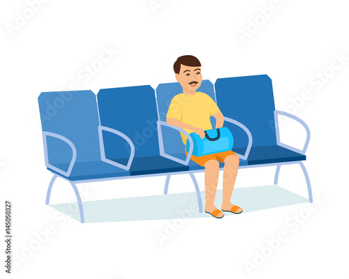 Man with luggage in hands in armchair of railway station.