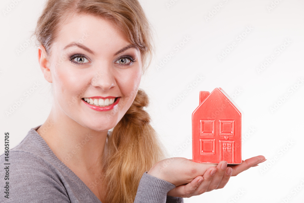 Smiling girl with home symbol. Smiling girl with home symbol.