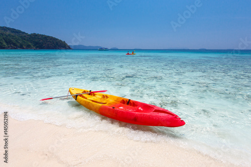 Colorful kayaks on tropical island beach, Thailand