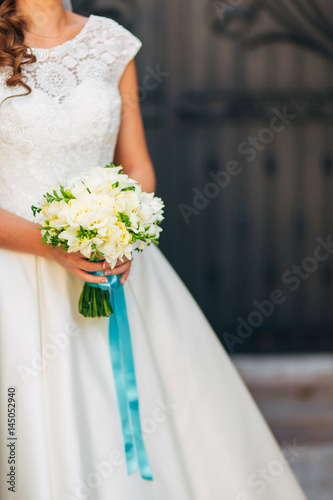 Wedding bouquet in hands of the bride. Wedding in Montenegro