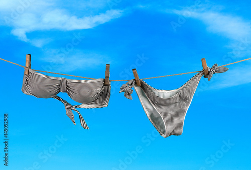 Summer vacation, swimwear on sky background