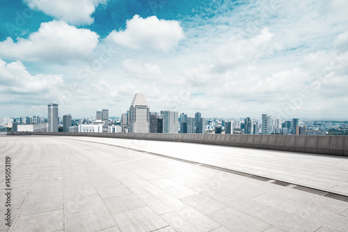 empty floor with cityscape of modern city