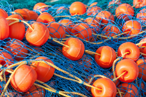 Bright fishing net with floats closeup