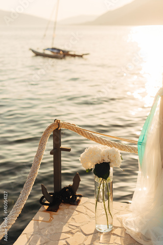 Flower compositions at the wedding ceremony. Wedding in Montenegro by the sea.