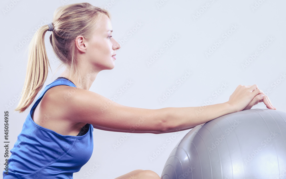 woman doing fitness exercises with fit ball woman doing fitness exercises with fit ball