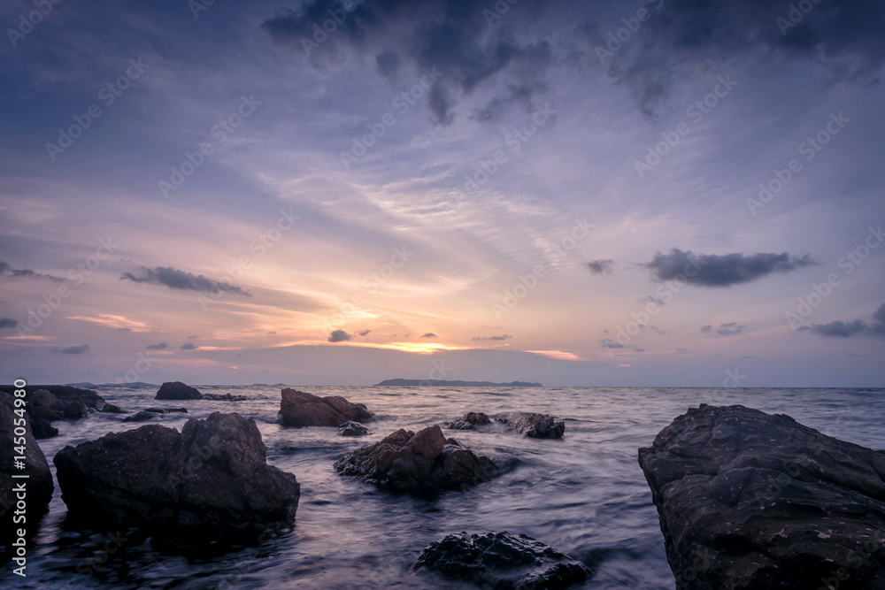 Tropical sunset on the stones beach. Koh Lan island. Thailand Tropical sunset on the stones beach. Koh Lan island. Thailand