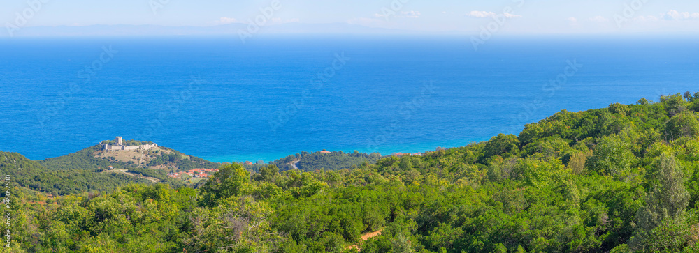 Top view on Mediterranean Sea bay with ancient Platamon castle on coast and distant islands. Pieria, Greece.
