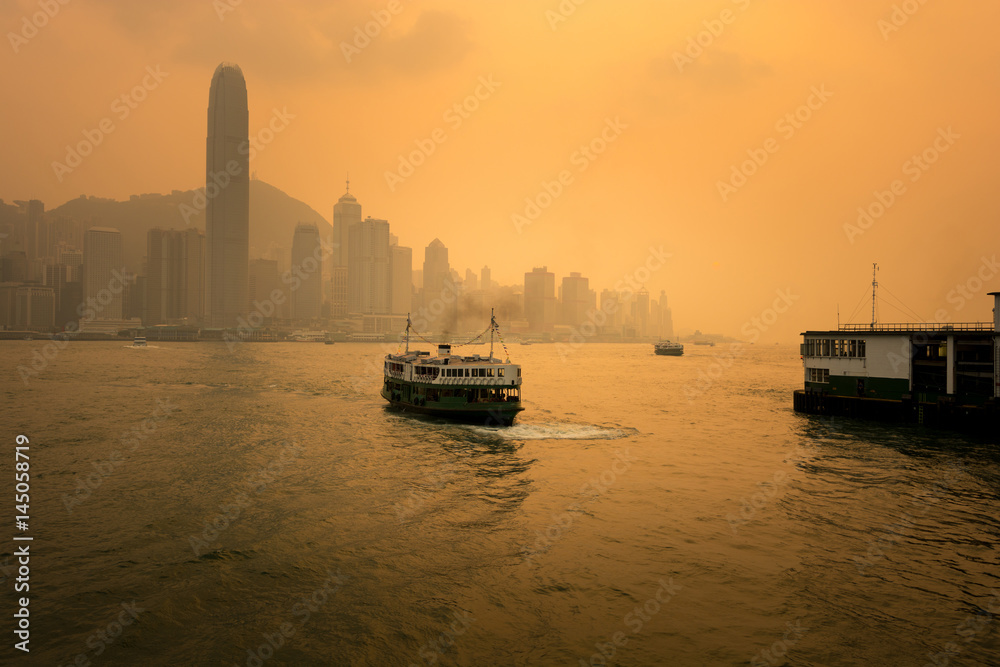 Hong Kong City skyline, ferry, and pier.