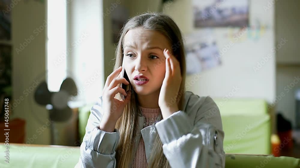 Stylish girl talking on cellphone in the cafe and receives bad news
Stylish girl talking on cellphone in the cafe and receives bad news